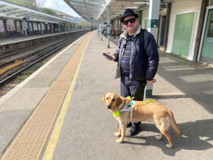 Cllr Paul Goddard and his guide dog, Stevie