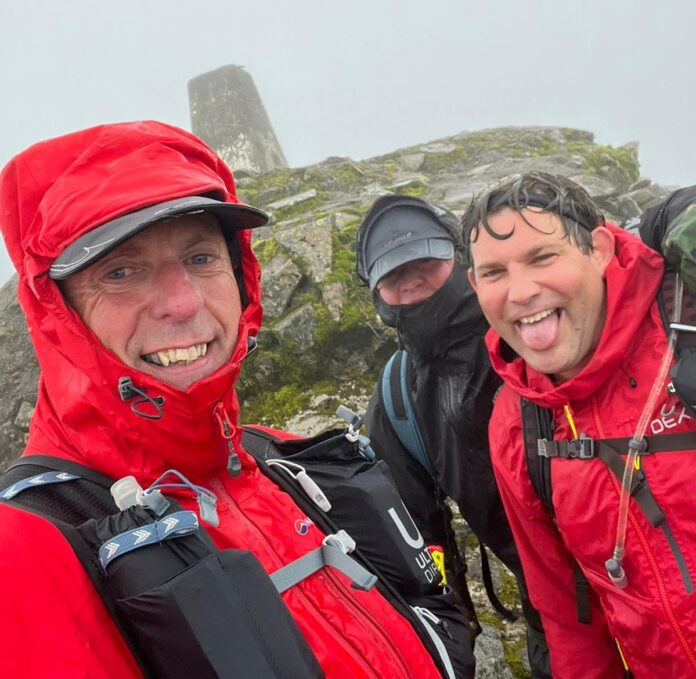 Three Peaks Challenge - three members of the Crowborough team at the summit of Ben Nevis