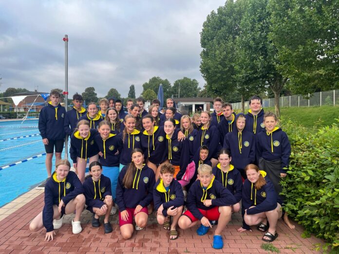 Members of the Beacon Swimming Club by the SV Greven pool
