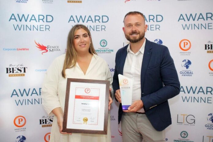 Dan and Erin Papper receiving the regional children's sports club of the year award