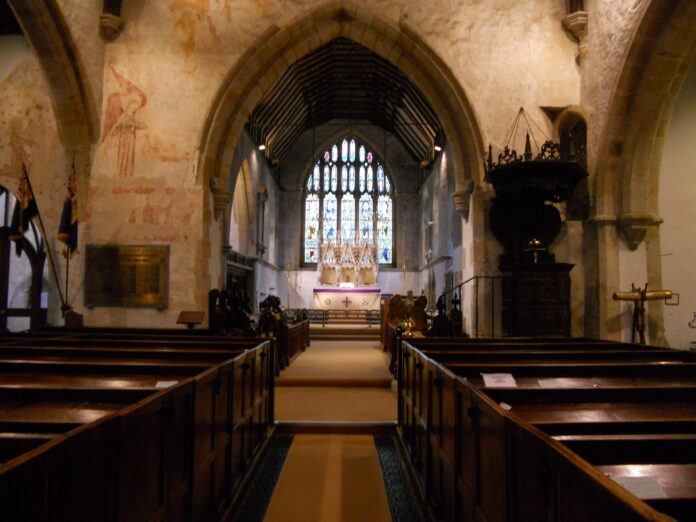 The interior of historic St Denys' Church showing its wall paintings