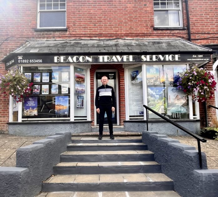 Paul Philpott in front of Beacon Travel Agents in Crowborough