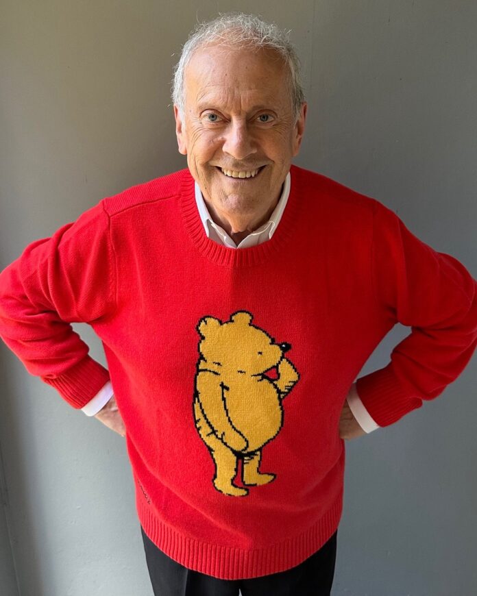 TV celebrity and author, Gyles Brandreth, wearing a Winnie-the-Pooh jumper