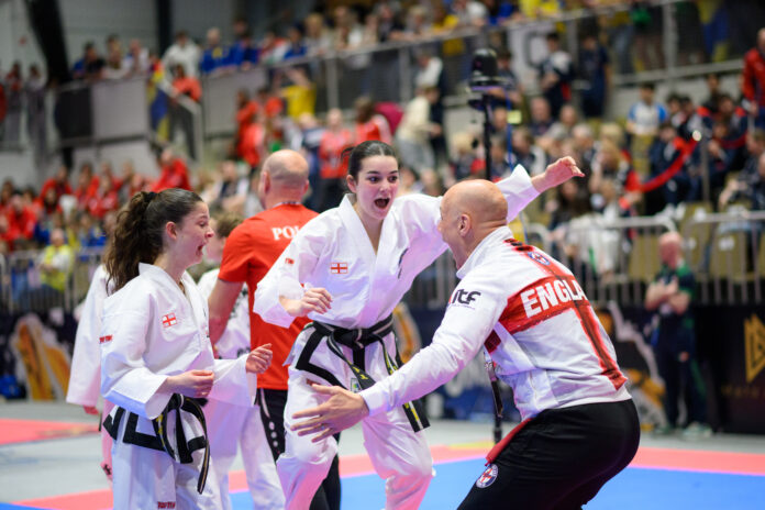 Vision Taekwondo members celebrate winning the gold medal