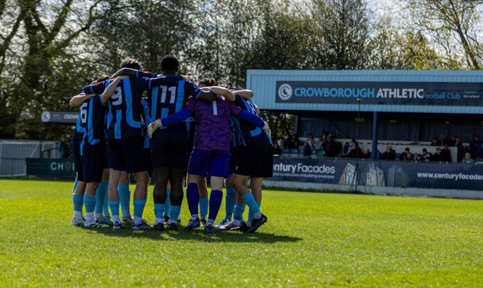 Crowborough Athletic FC team huddle